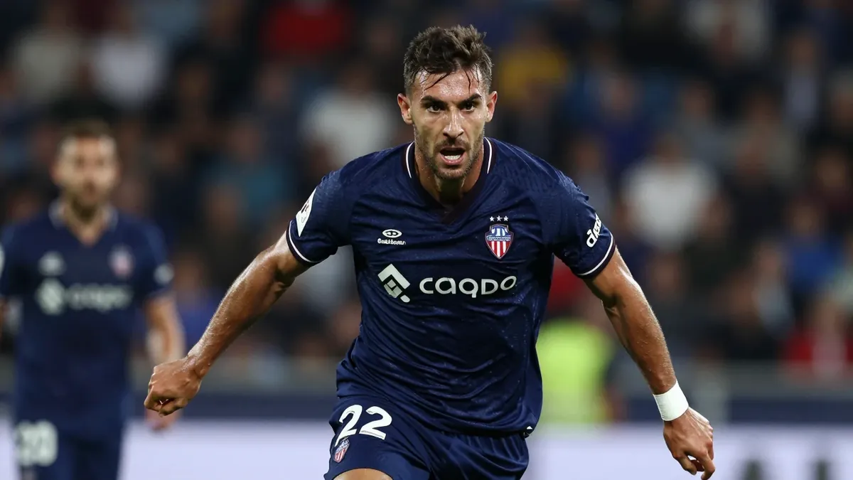 An image of Oscar Duarte in the 2022 derby against Valencia, published by Reuters Connect, contrasts with Levante UD's...